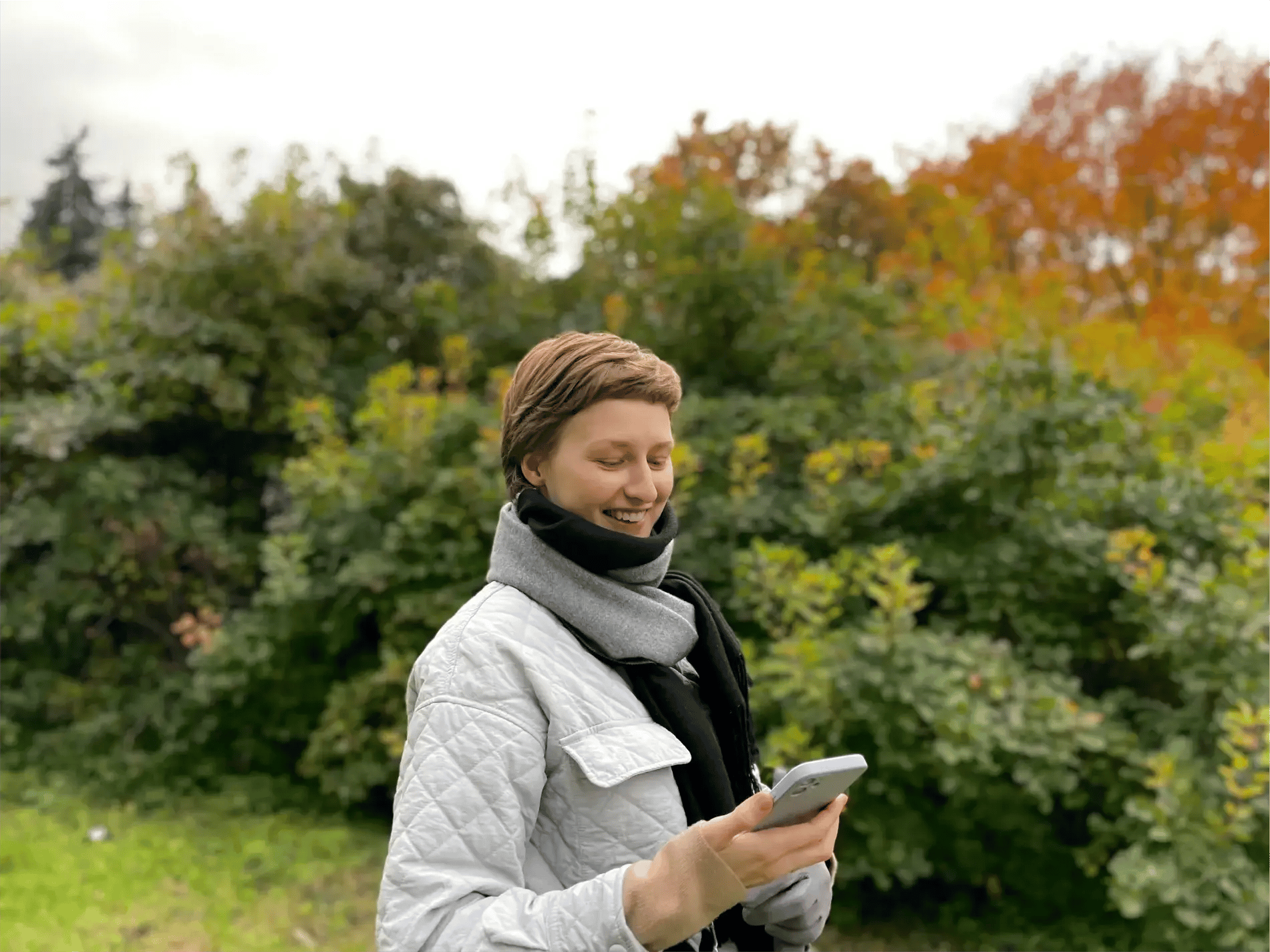 Woman-smiling-at-phone